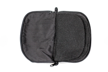 Load image into Gallery viewer, Interior view of black jewelry/sewing case featuring pockets and felt pages.