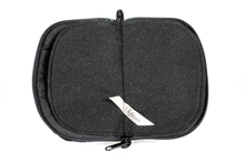 Load image into Gallery viewer, Interior view of black jewelry/sewing case featuring pockets and felt pages.