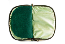Load image into Gallery viewer, Interior view of jewelry/sewing case showing shimmery light green lining and pockets and dark green felt pages.