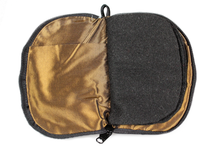 Load image into Gallery viewer, Interior view of jewelry/sewing case showing dark gold lining and pockets and black felt pages.