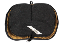 Load image into Gallery viewer, Interior view of jewelry/sewing case showing dark gold lining and pockets and black felt pages.
