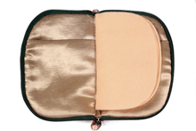 Load image into Gallery viewer, Interior view of jewelry/sewing case showing champagne colored lining and pockets and peach colored pages.