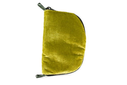 Front view of olive green velvet jewelry/sewing case with a dark green zipper and two green loops, one situated at the top and one at the bottom. 