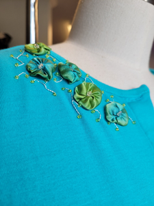 An example of silk flowers on a shirt.