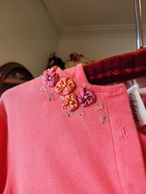 Load image into Gallery viewer, An example of silk flowers on a shirt.
