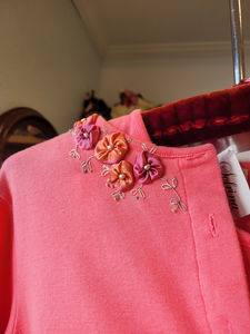 An example of silk flowers on a shirt.