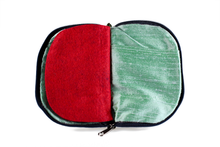 Load image into Gallery viewer, Interior view of jewelry/sewing case showing mermaid iridescent teal lining with pockets and red felt pages.
