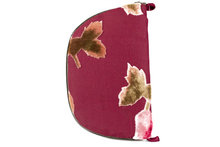 Load image into Gallery viewer, Back  view of dark rose colored burnout velvet jewelry/sewing case showing velvet roses, a dark green zipper, and two small burgundy loops, one situated at the top and one at the bottom.
