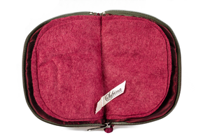 Interior view of jewelry/sewing case showing burgundy lining, pockets, and felt pages.