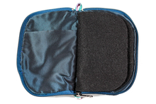 Load image into Gallery viewer, Interior view of jewelry/sewing case showing midnight blue lining and pockets, and black felt pages.
