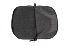 Load image into Gallery viewer, Interior view of black jewelry/sewing case featuring pockets and felt pages.
