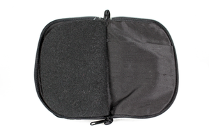 Interior view of black jewelry/sewing case featuring pockets and felt pages.