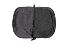 Load image into Gallery viewer, Interior view of black jewelry/sewing case featuring pockets and felt pages.
