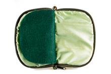 Load image into Gallery viewer, Interior view of jewelry/sewing case showing shimmery light green lining and pockets and dark green felt pages.
