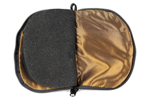 Load image into Gallery viewer, Interior view of jewelry/sewing case showing dark gold lining and pockets and black felt pages. 
