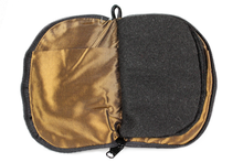 Load image into Gallery viewer, Interior view of jewelry/sewing case showing dark gold lining and pockets and black felt pages.
