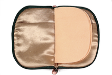 Load image into Gallery viewer, Interior view of jewelry/sewing case showing champagne colored lining and pockets and peach colored pages.
