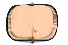 Load image into Gallery viewer, Interior view of jewelry/sewing case showing champagne colored lining and pockets and peach colored pages. 
