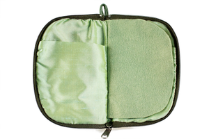 Interior view of jewelry/sewing case with light green lining and felt pages.