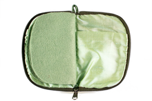 Load image into Gallery viewer, Interior view of jewelry/sewing case with light green lining and felt pages. 
