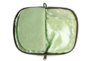 Interior view of jewelry/sewing case with light green lining and felt pages. 