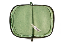 Load image into Gallery viewer, Interior view of jewelry/sewing case with light green lining and felt pages.
