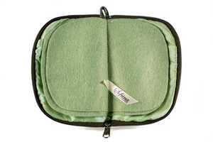 Interior view of jewelry/sewing case with light green lining and felt pages.